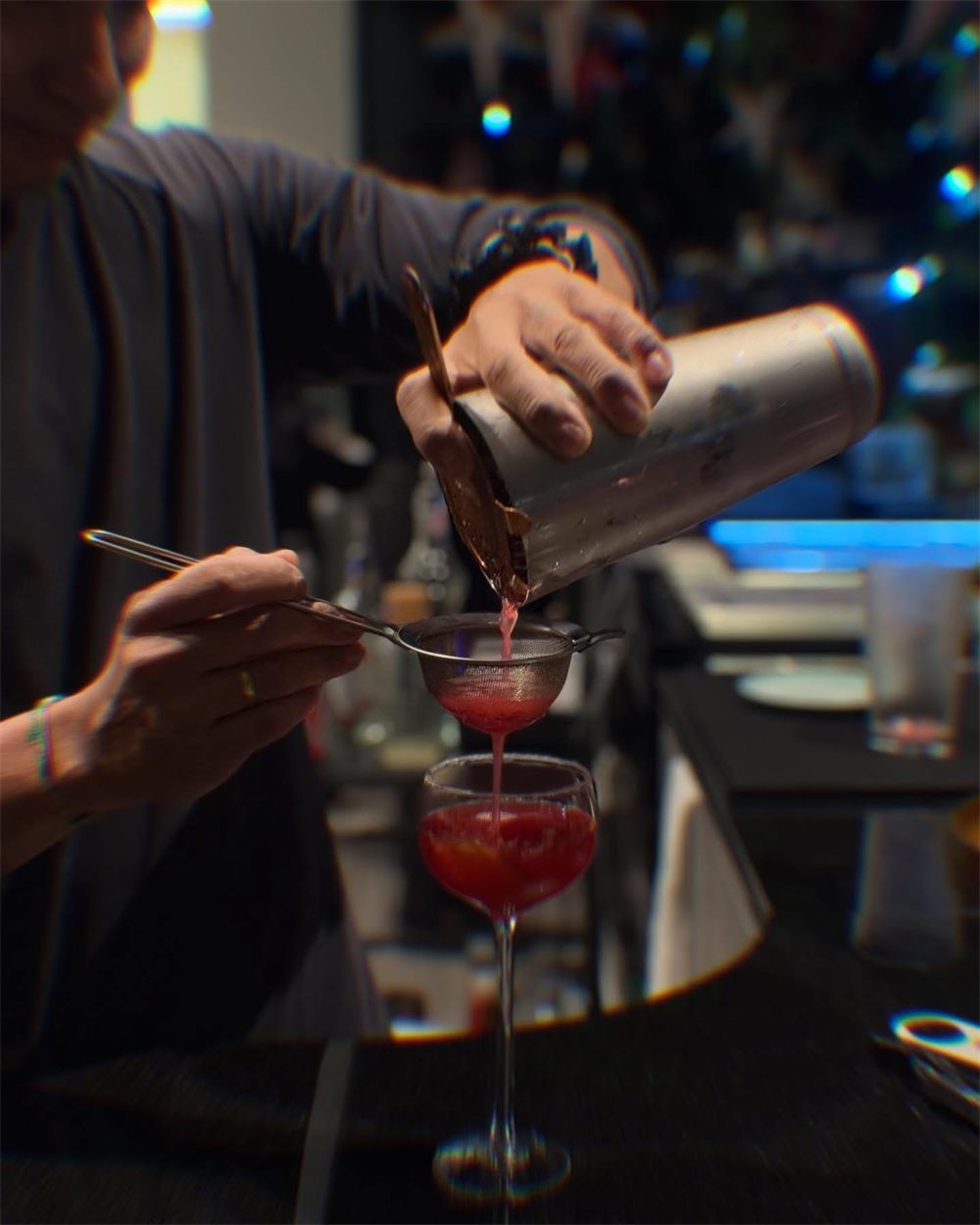 Bartender pouring a signature cocktail